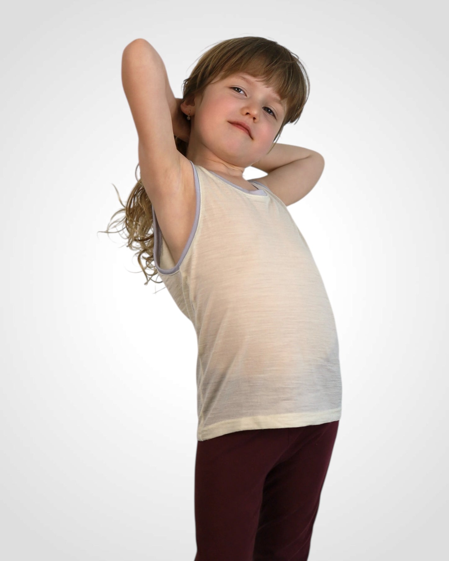 Detské tielko z nefarbenej merino vlny s výberom farebných lemov – šetrné k citlivej pokožke.